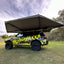 rooftop tent open and attached to black 4wd with bushwakka branding